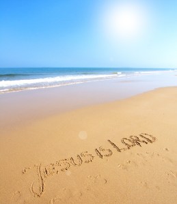 Beautiful beach with sand, blue waves and sky